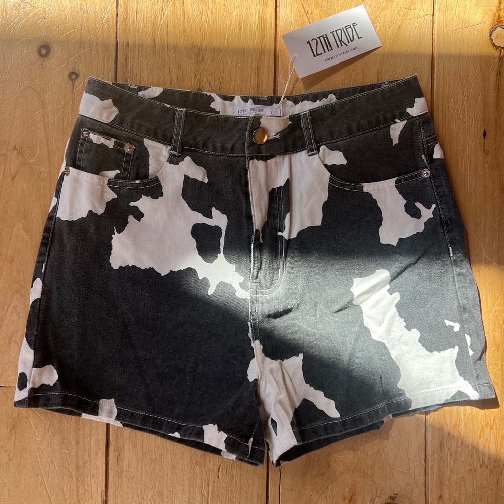 12th Tribe Black and White Cow Print Women's Shorts